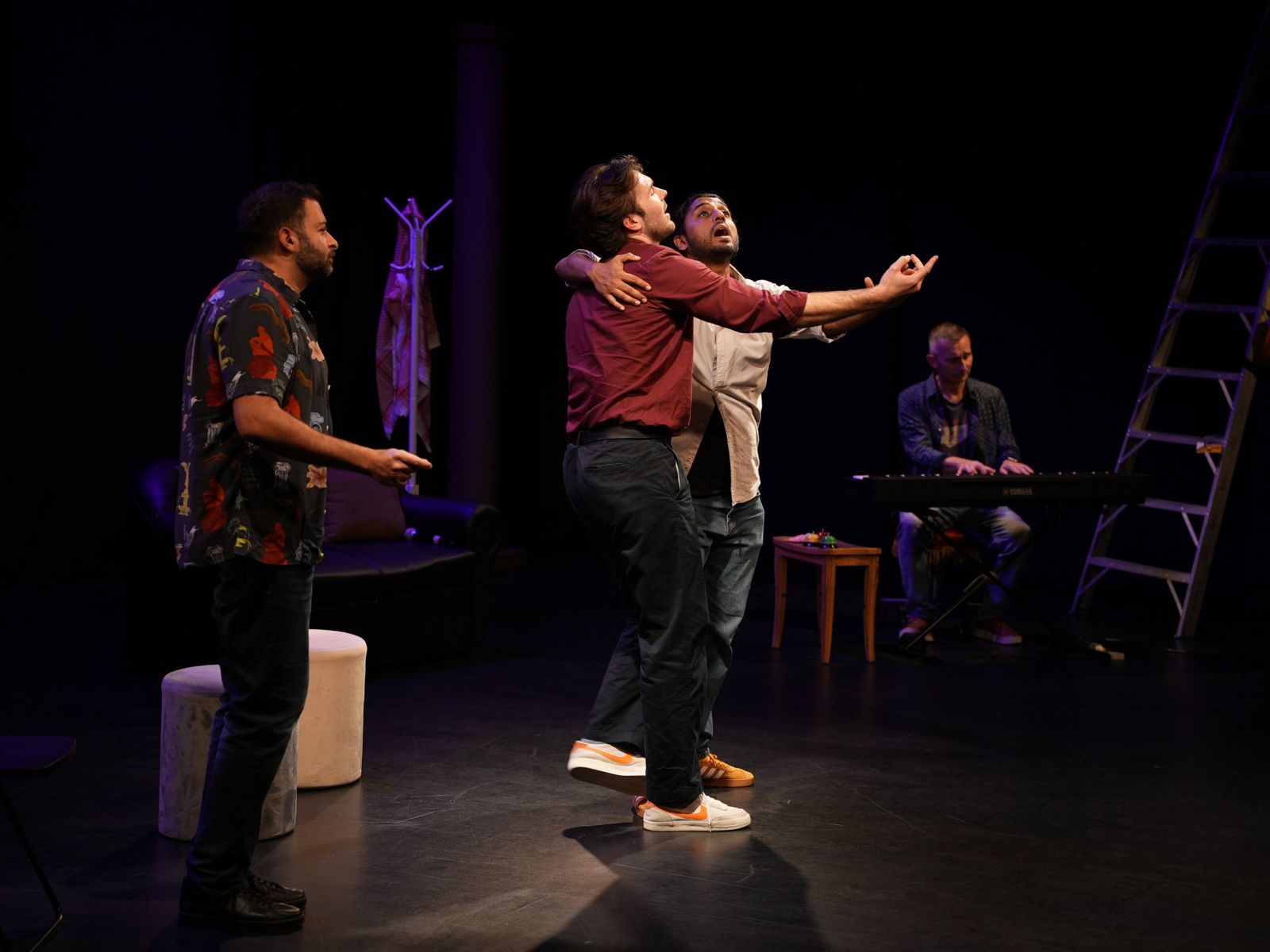 Karak After Dark improv performers on stage in Dubai with a live pianist
